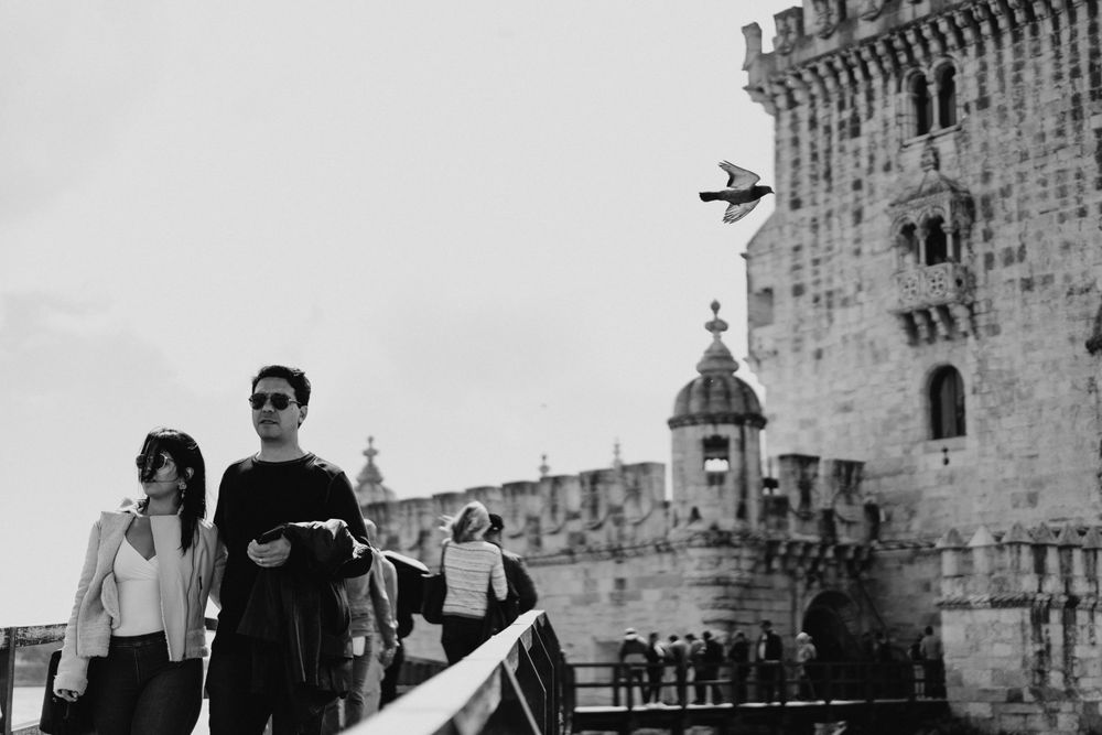 Historic stone fortress with medieval architecture and towers in black and white.