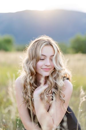 Candid moment in mountain meadow with soft natural lighting.