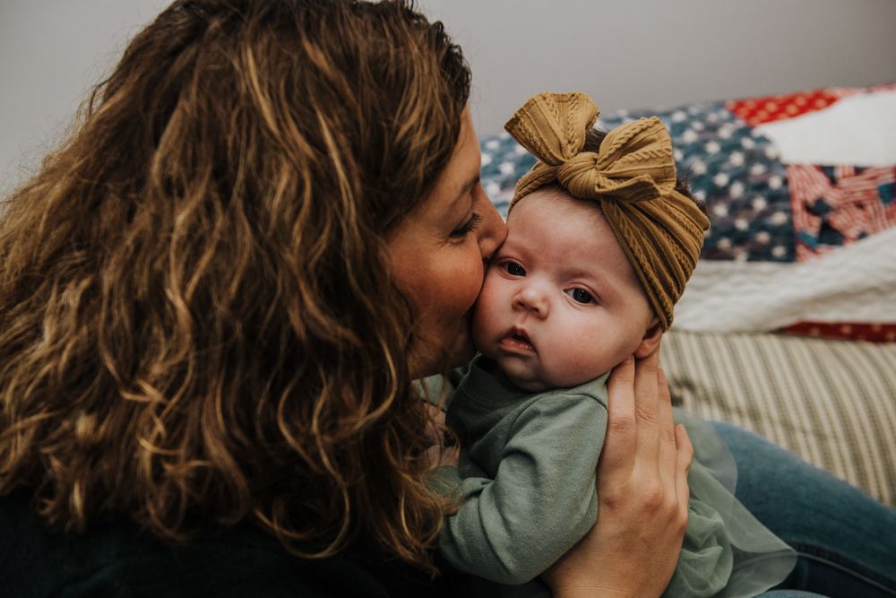 Lifestyle photography capturing intimate family moments on a couch.
