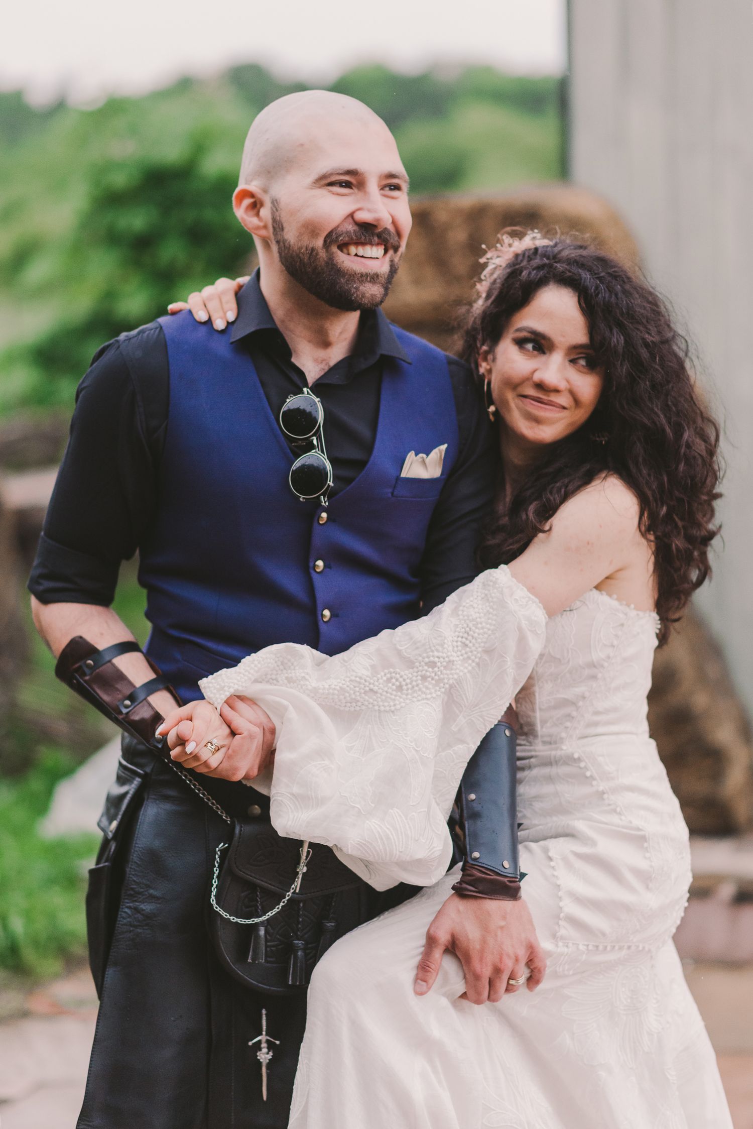 Couple sharing a romantic moment outdoors during their wedding celebration.