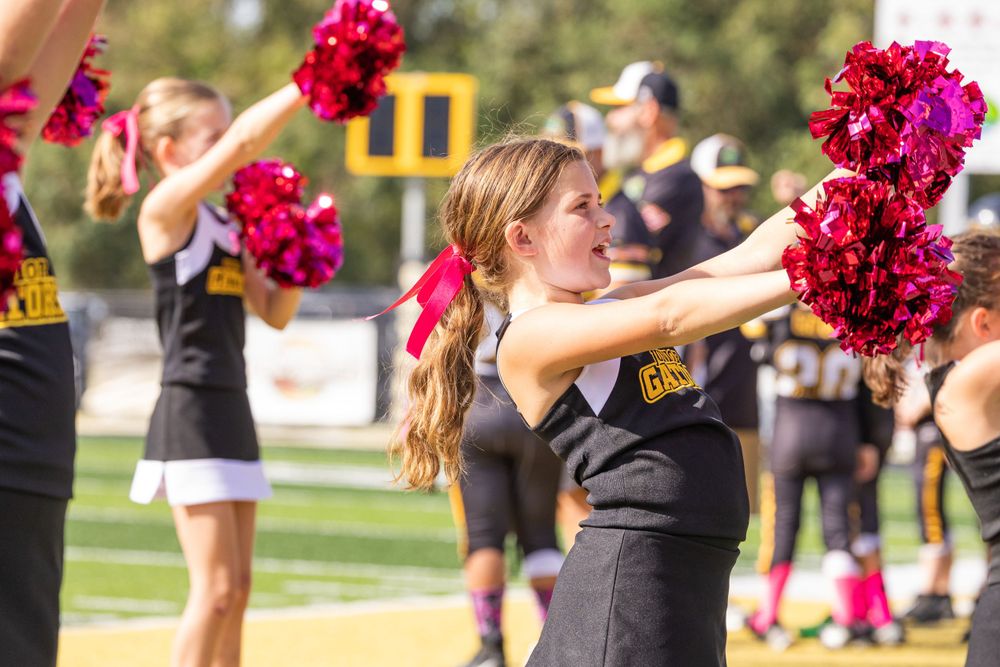 Cheerleader on a sideline during a football game