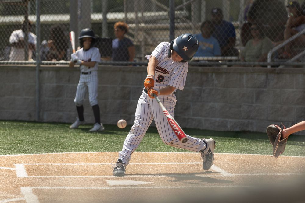 Baseball player swinging a bat