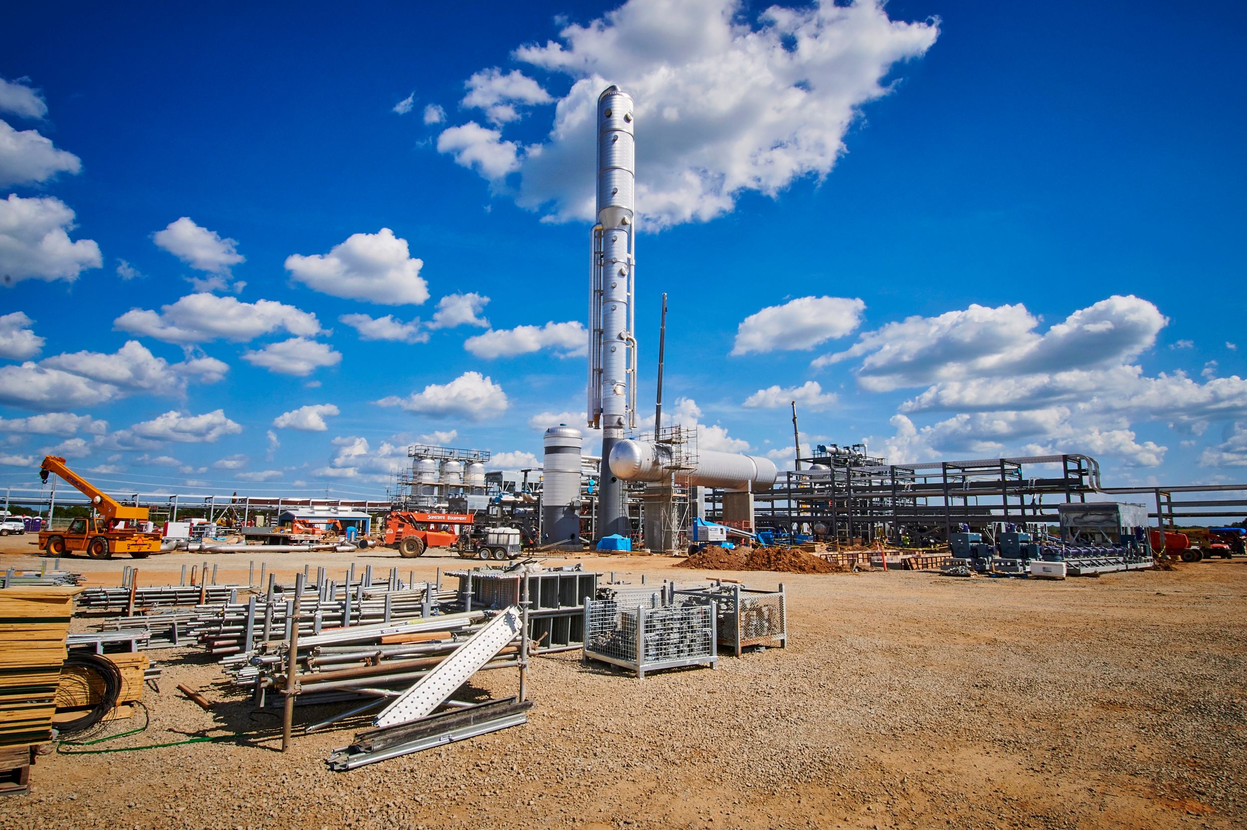 Drilling rig with blue sky and clouds