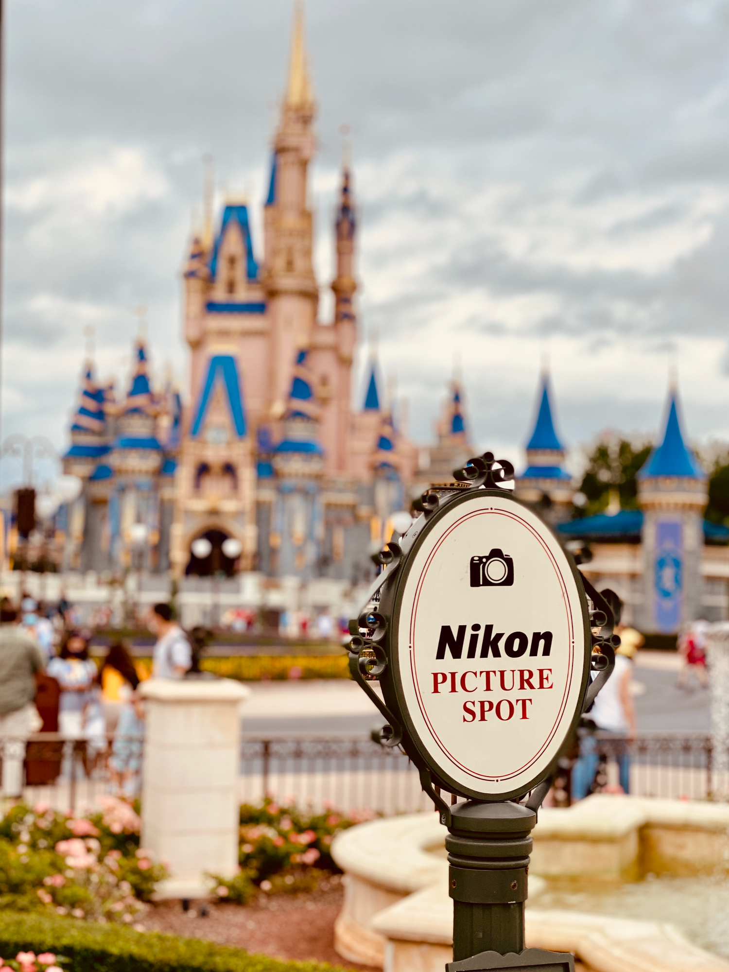 Nikon picture spot sign in front of Cinderella Castle at Disney World.