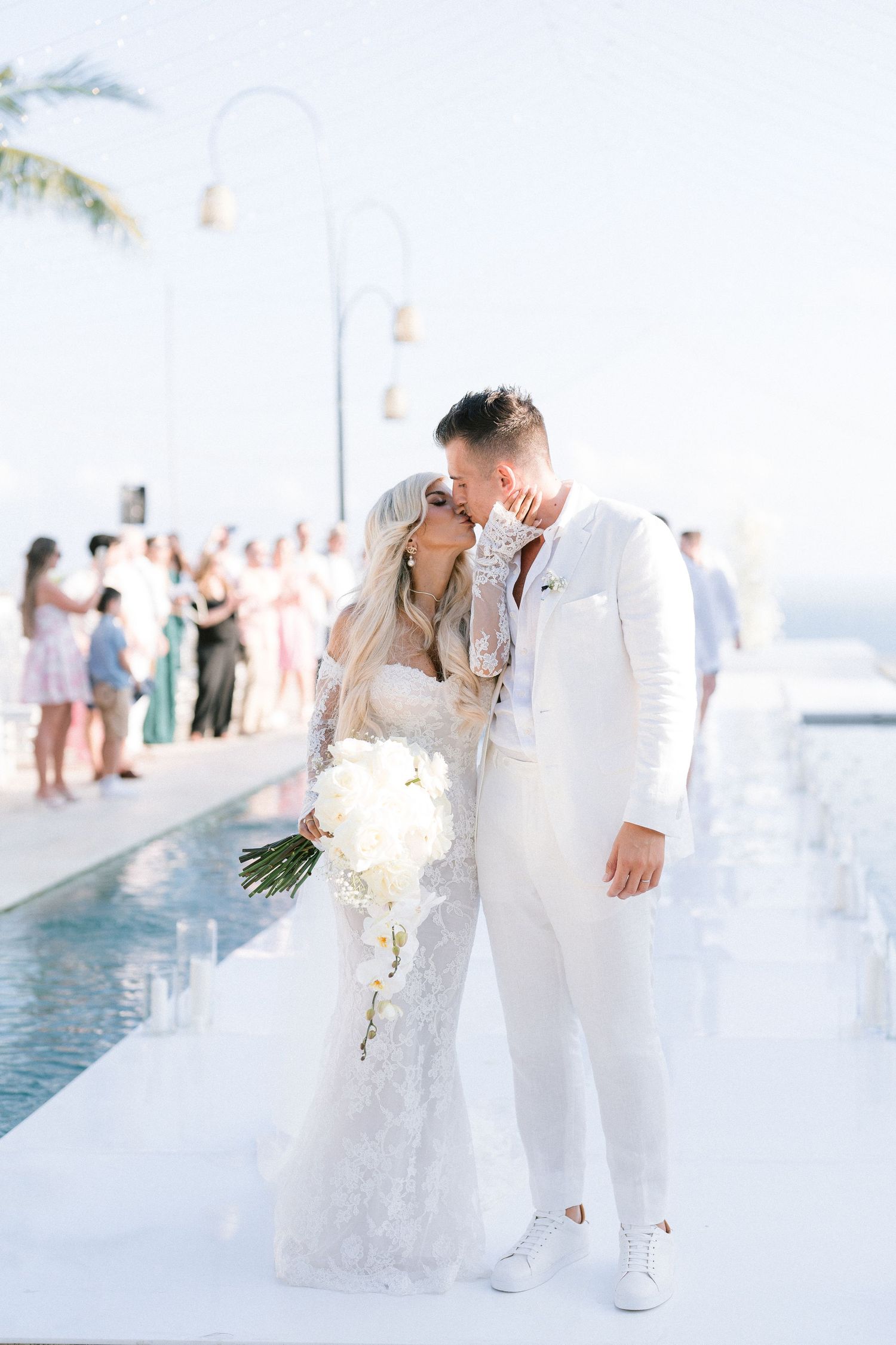 Bride and groom kiss during recessional