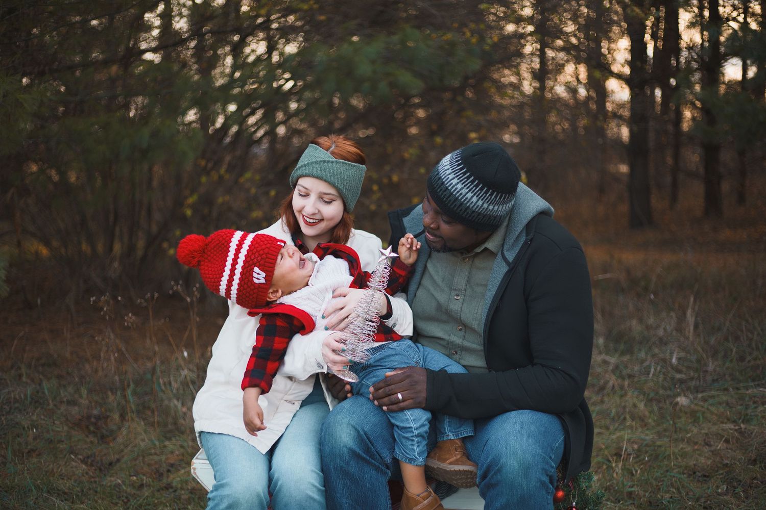 token creek county park deforest madison wi family photography christmas mini session parents holding screaming toddler