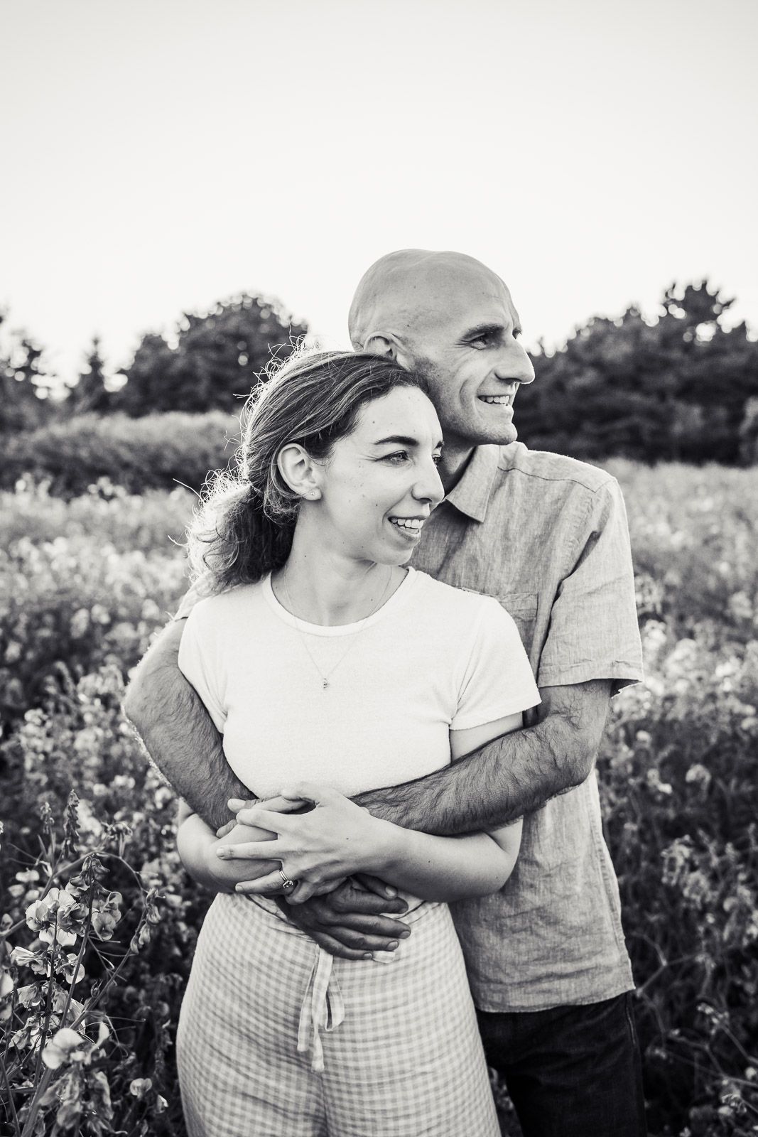 Black and white photo of husband and wife in Discovery Park.