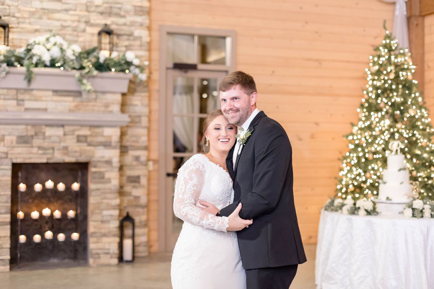 bride and groom dance together during first dance at christmas wedding