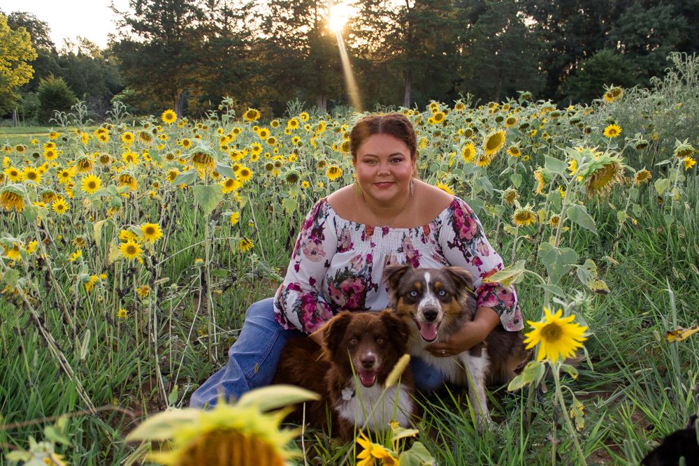 Dog mom pet family fall sunflower field pictures Cindee Miller Give It A Shot Photography St. Louis family photographer