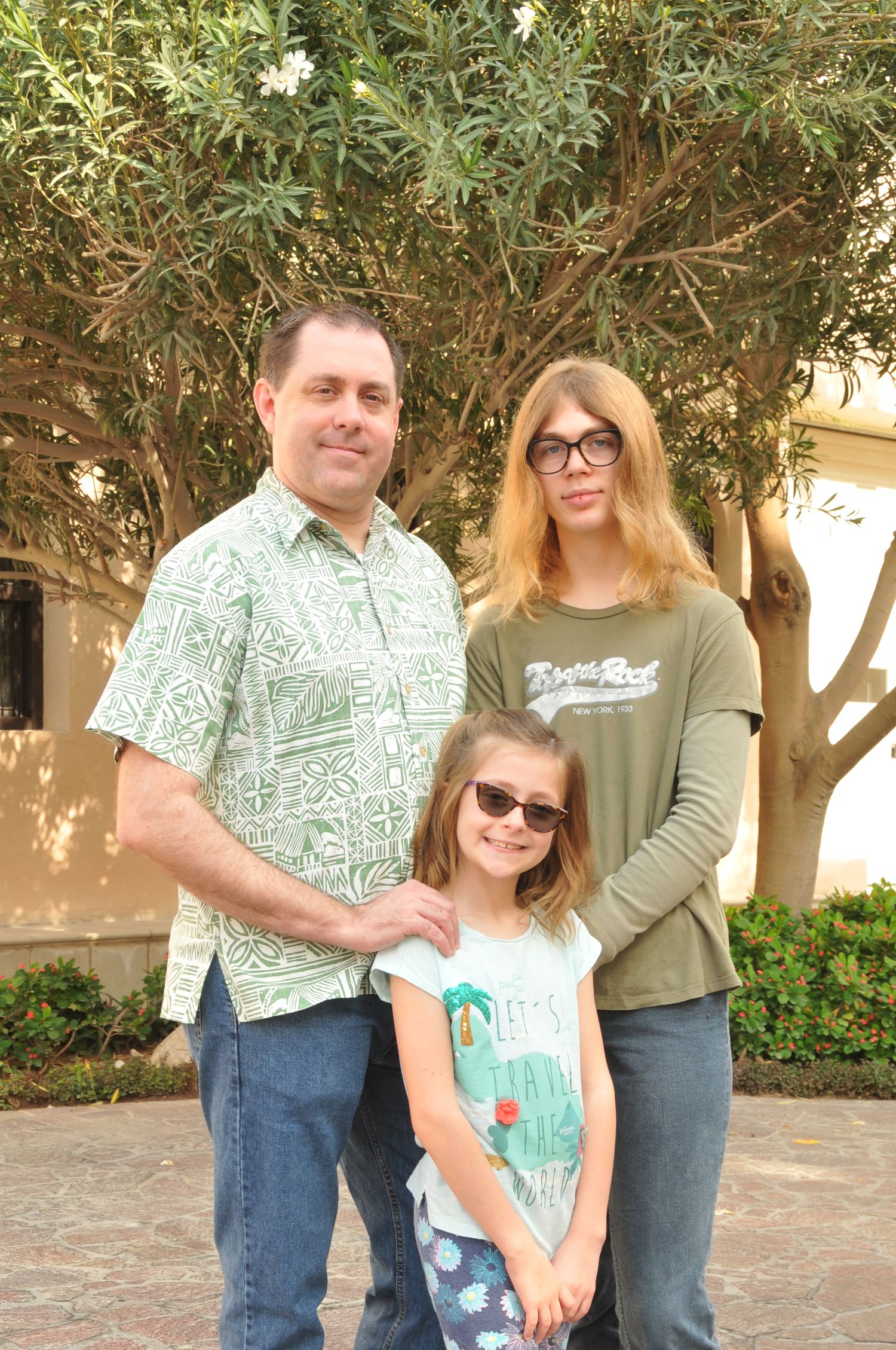 Outdoor photo of father and children