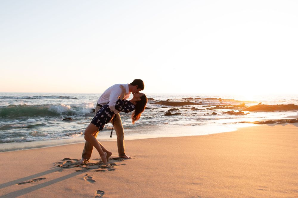 Engagement session doing the dip kiss at Victoria Beach in Laguna Beach