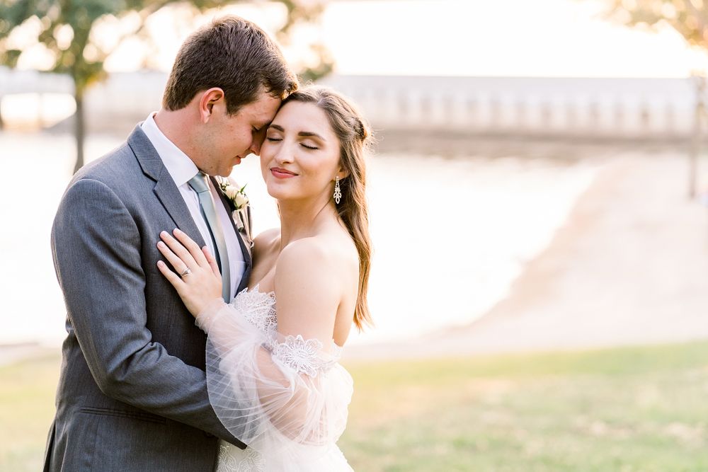 Romantic outdoor portrait session with couple in wedding attire during golden hour.