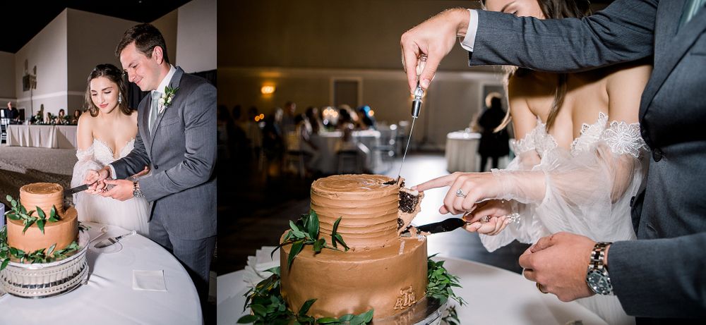 Wedding cake cutting ceremony with chocolate and vanilla tiers decorated with greenery.