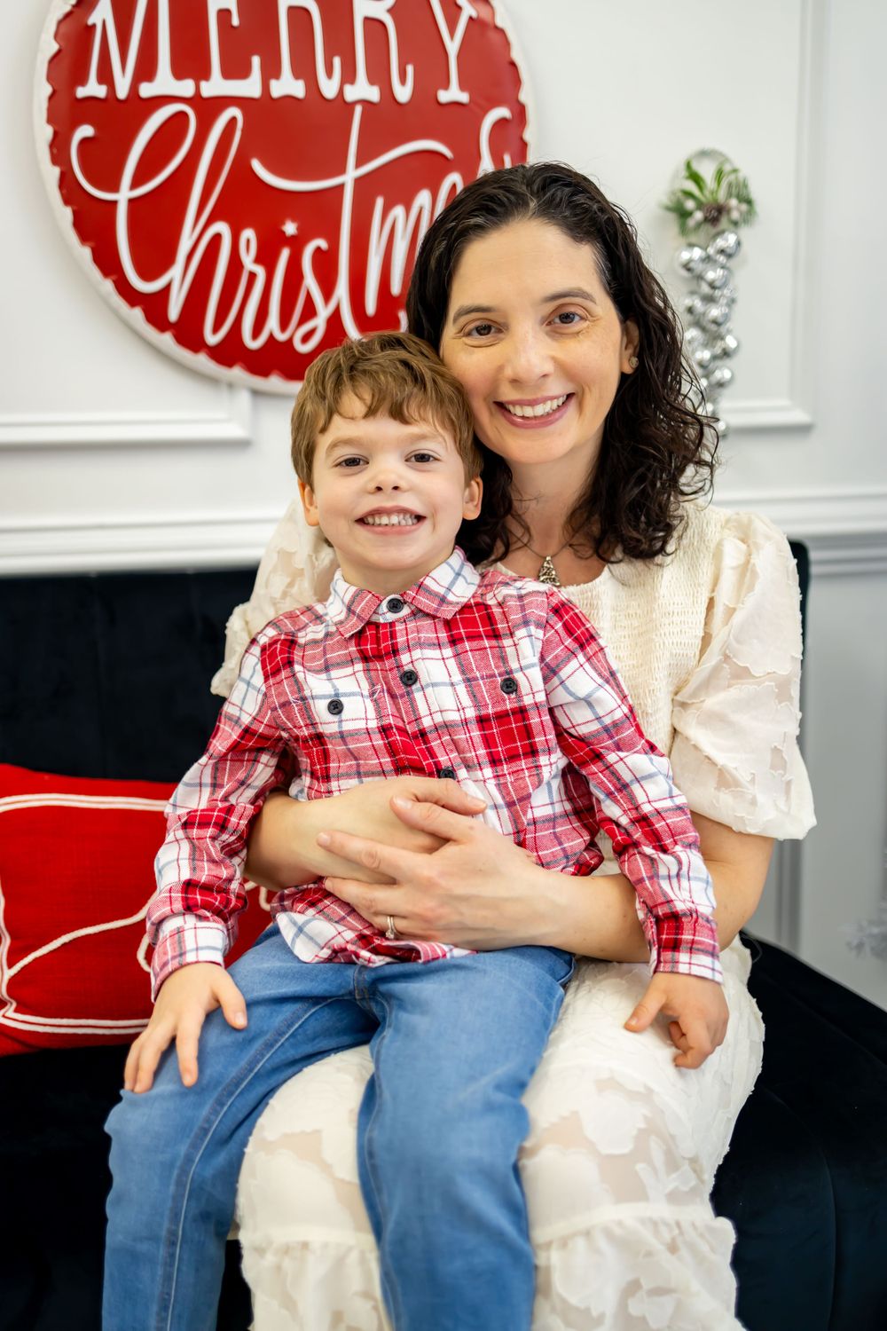 mother and son smiling for their christmas pictures