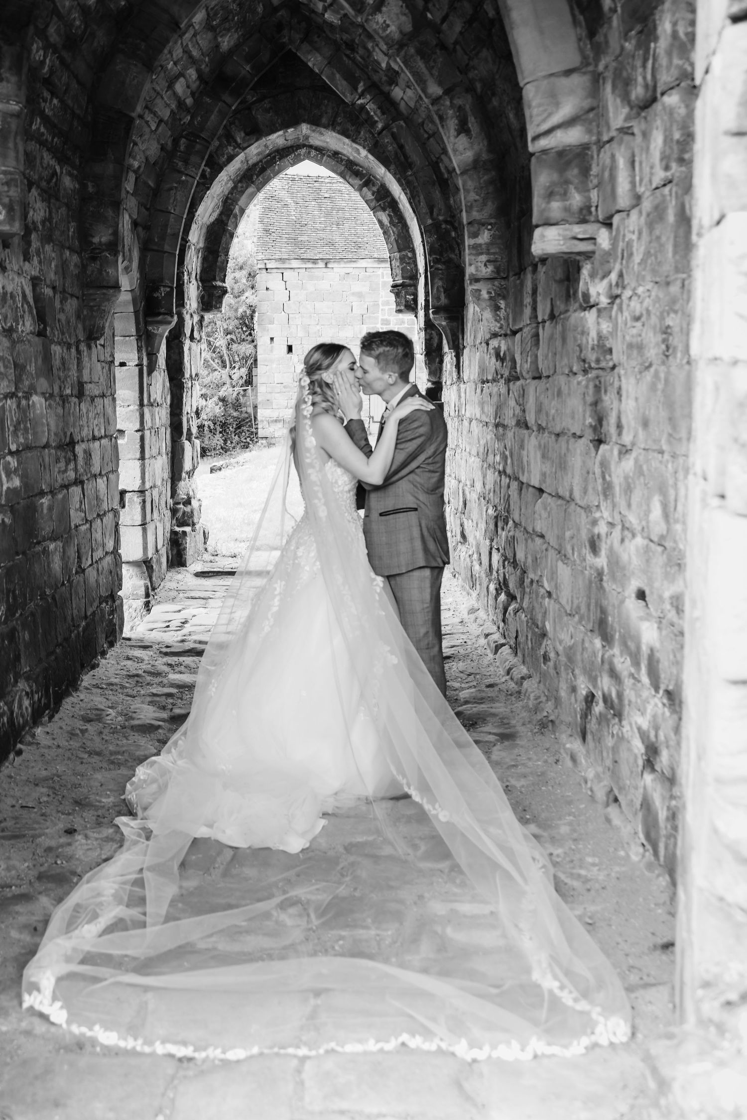 Bride and groom share a kiss at their Derbyshire Wedding