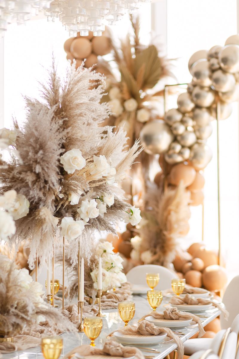 a detail view of a floral arrangement with roses and pampas grass in nude colors for a baby shower at Hudson Yards