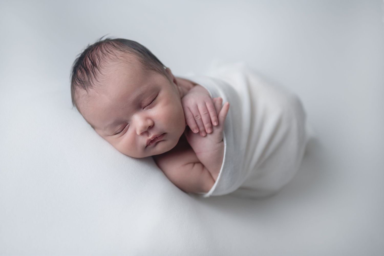 Boy in white wrap - Newborn photography session in Clarksville TN