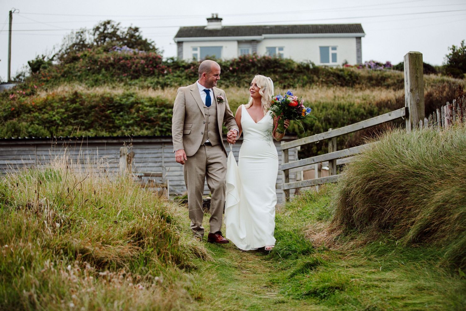 west cork wedding bride and groom on their way to the beach
