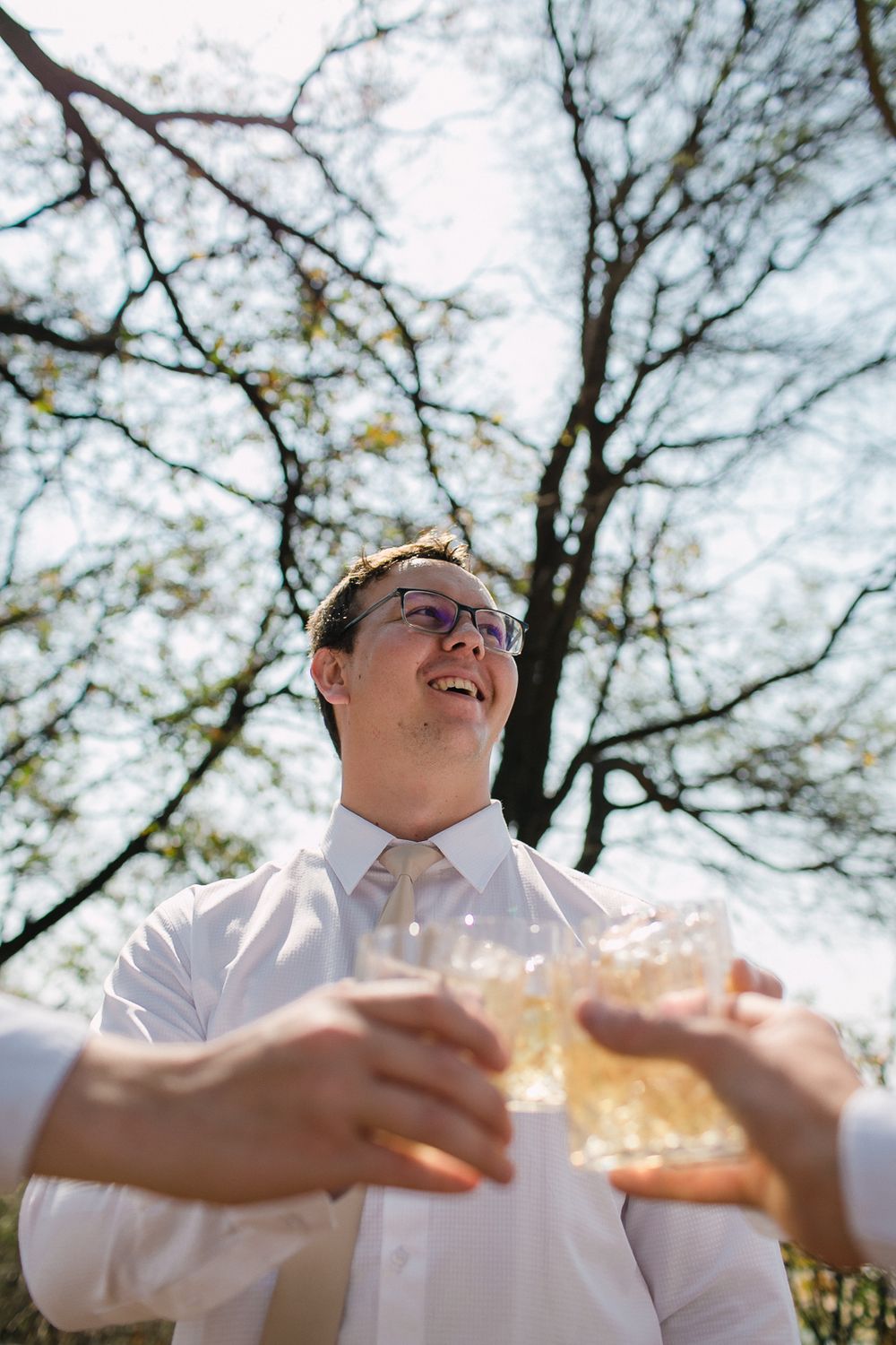 A groom and his groomsmen has one last whisky before the wedding ceremony.