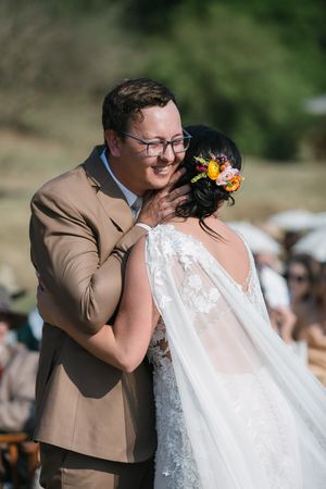 Wichert hugs his bride as she arrives at the wedding ceremony.