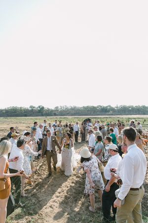Confetti rains down on Johane and Wichert after their safari wedding ceremony.
