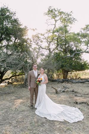 A safari wedding in the Kruger National park where the couple pose for thier formal portraits.