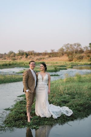 A couple standing on a little island right in the Letaba riverbed.