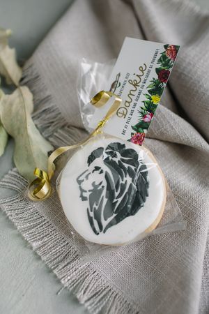 Custom made lion cookie wedding guest favour and thank you card.