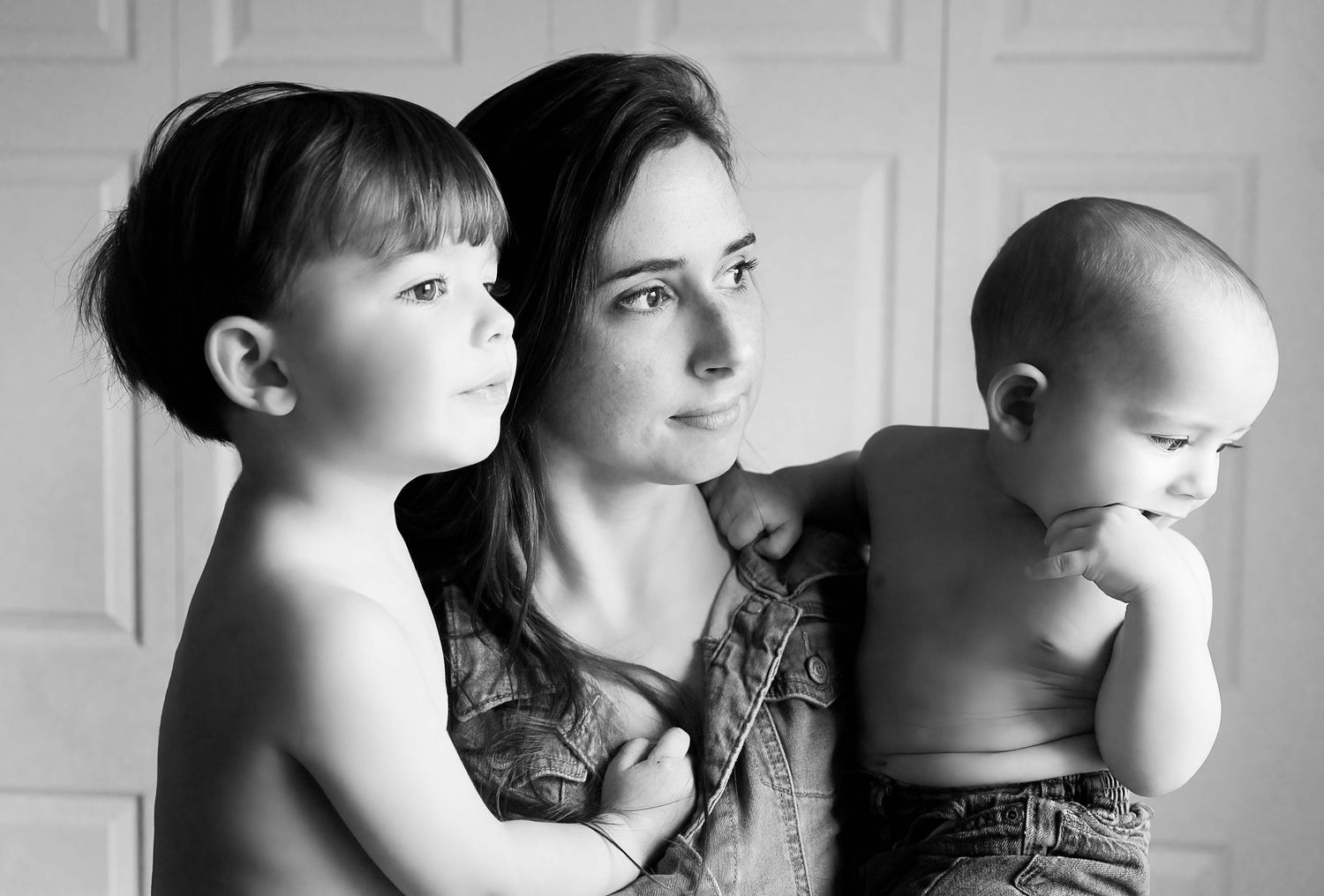 black and white photo of mom with two kids