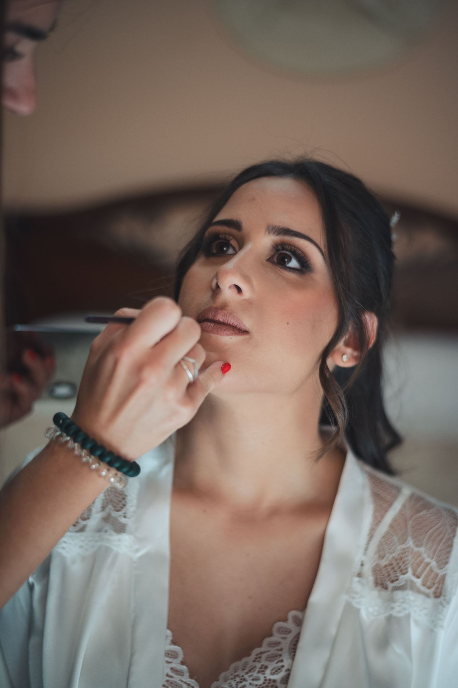 Close up shot of lip color being applied during professional makeup session.