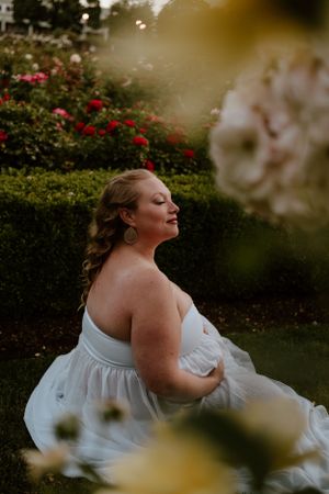 Dreamy garden photography through blooming flowers at golden hour.