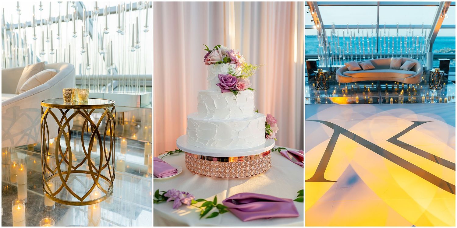 Wedding reception details featuring an elegant white cake and modern decor in a glass-enclosed venue.