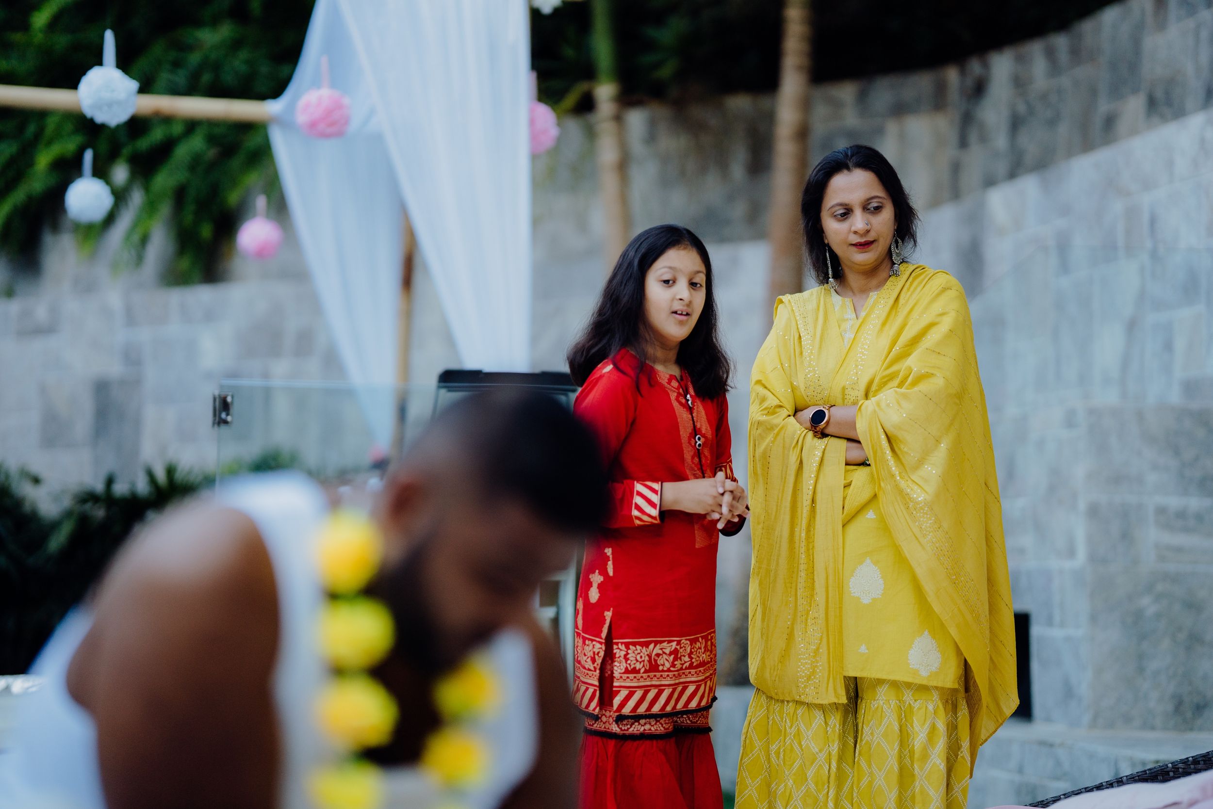 Guests in traditional Indian attire gathered during a cultural celebration.