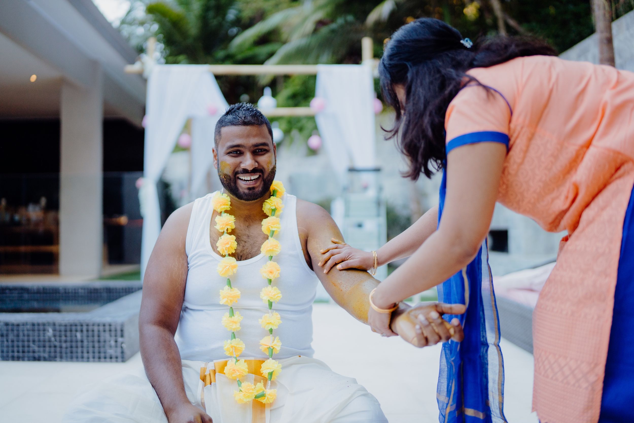 Traditional ritual ceremony taking place in an outdoor setting with decorative elements.