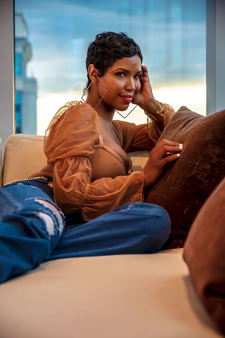 Female sitting on couch.