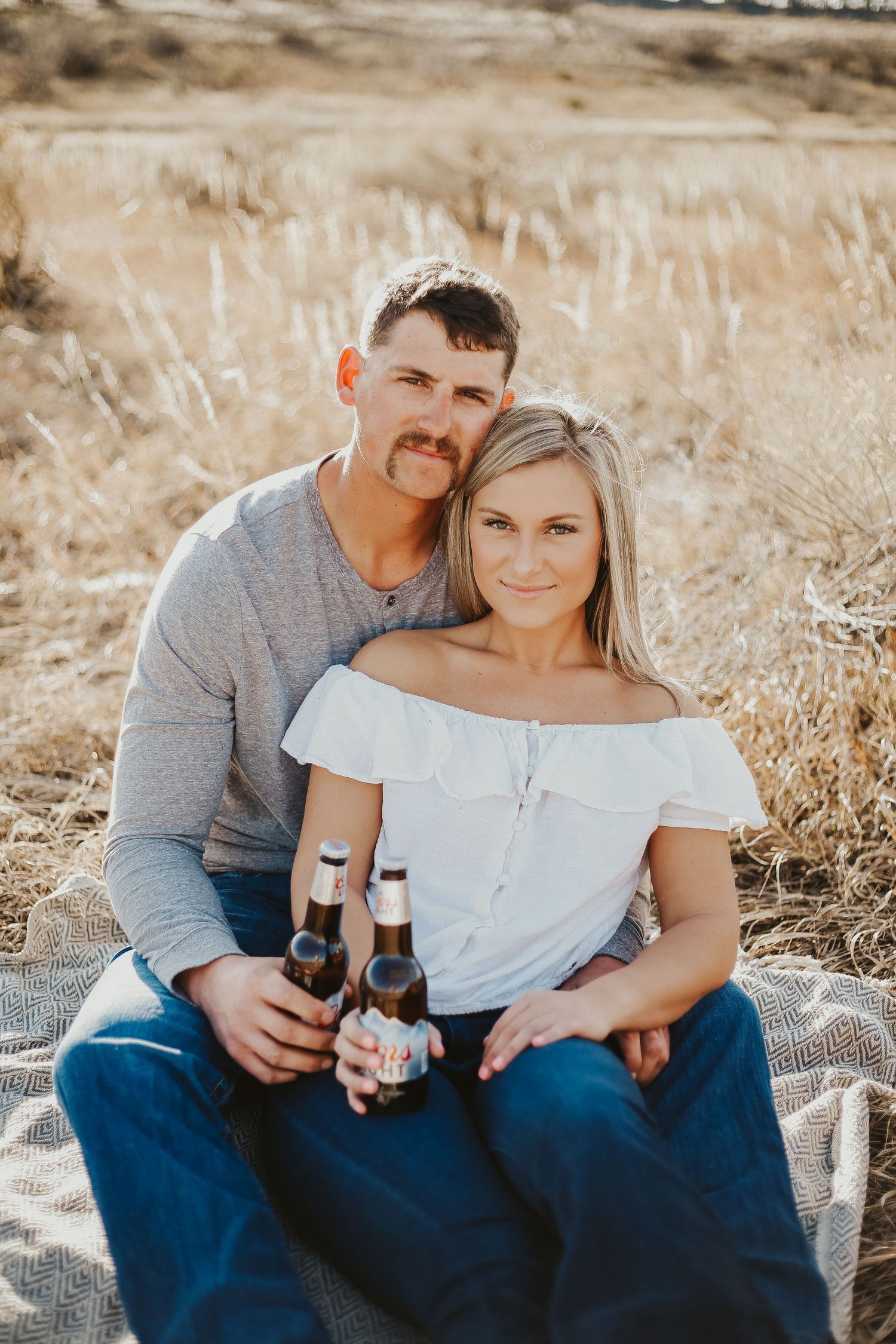 Couple posed with beer.