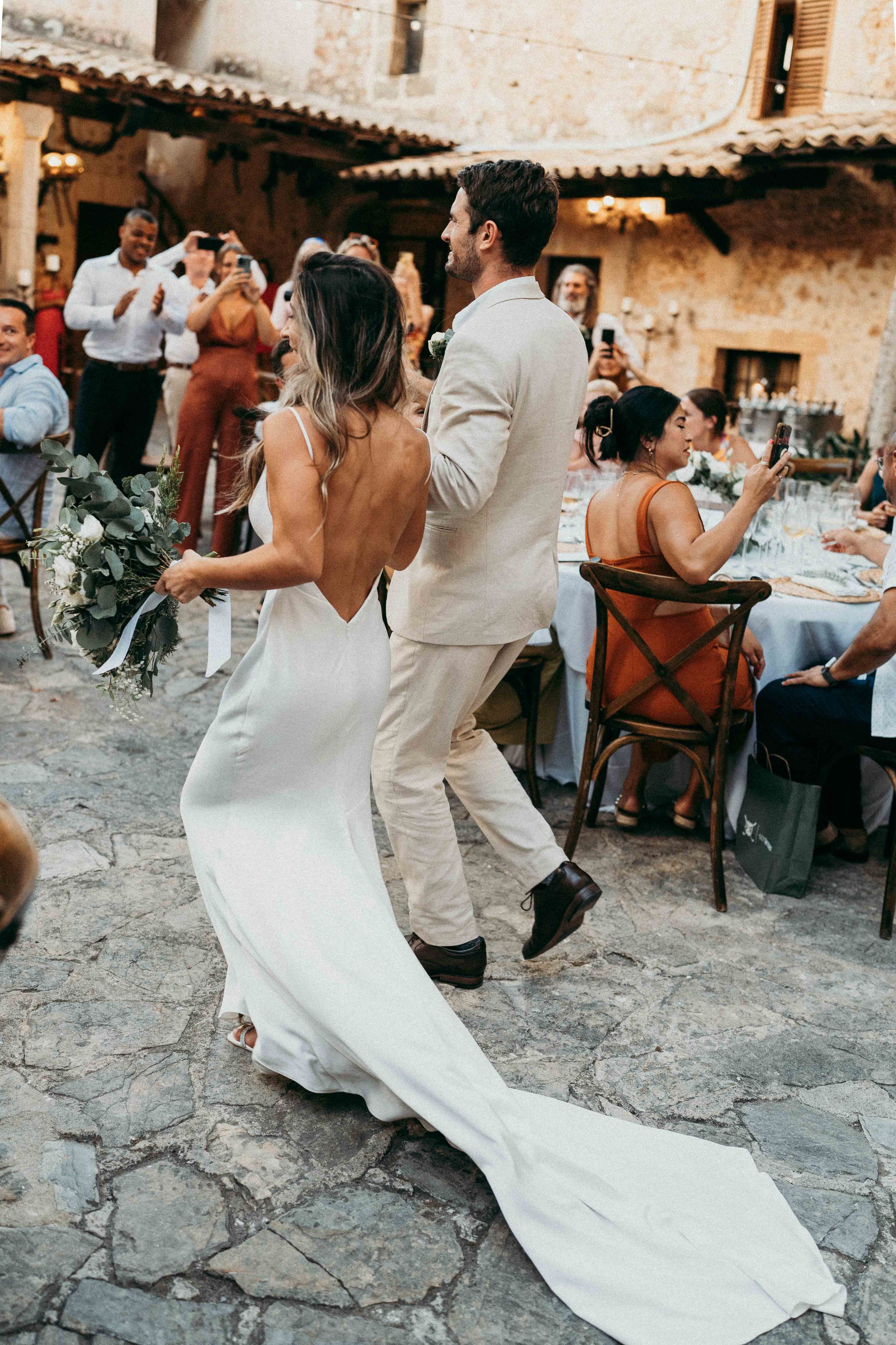 Couple entering the reception dinner in Finca Son Termes, Mallorca.