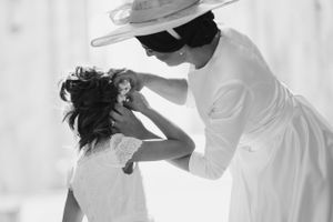 A series of artistic black and white wedding photos with flowing white dresses.