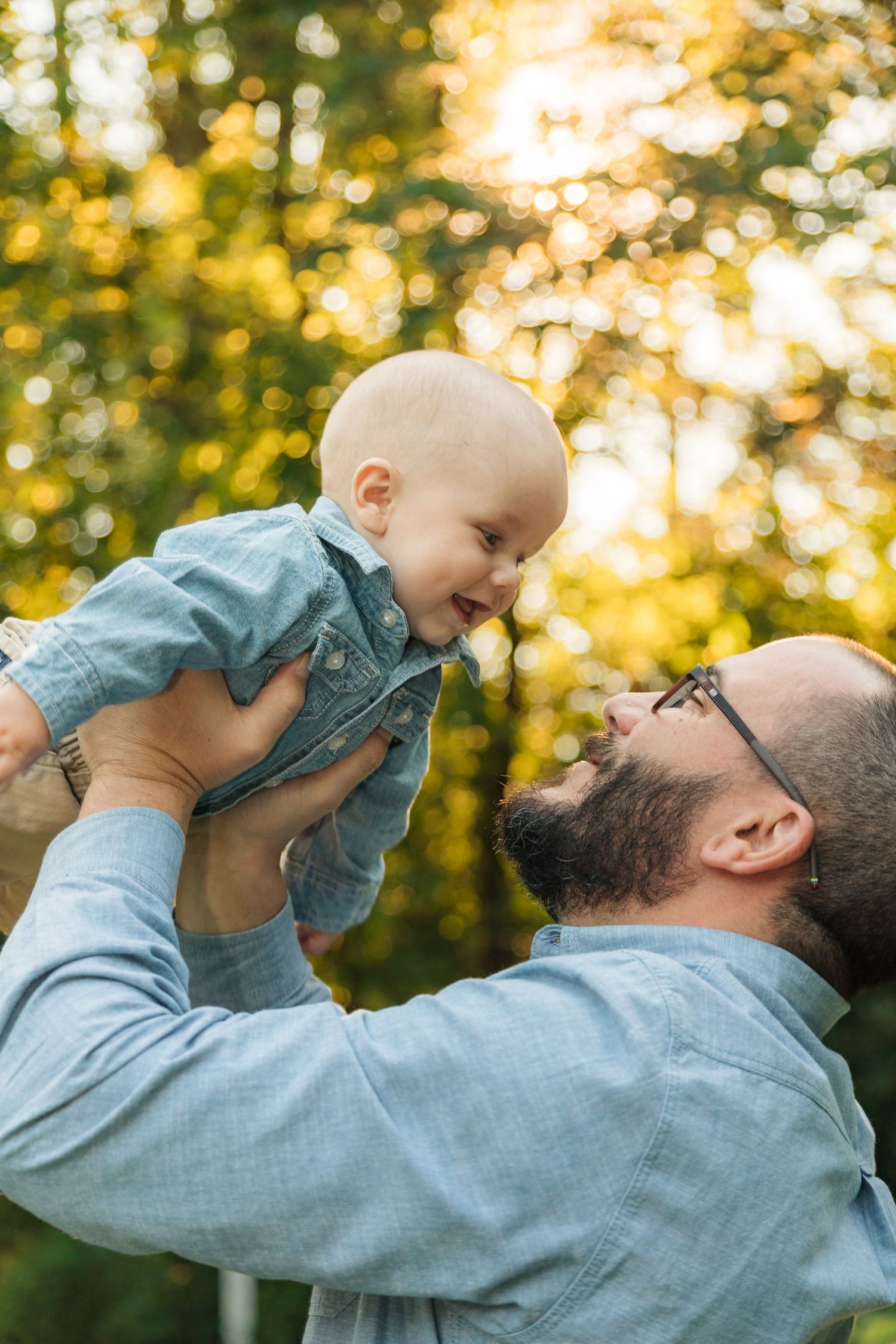 Father and infant sun at golden hour in Wayzata