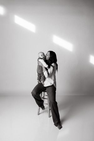 Black and white artistic photo series showing two dancers performing an intimate contemporary duet in a studio setting.