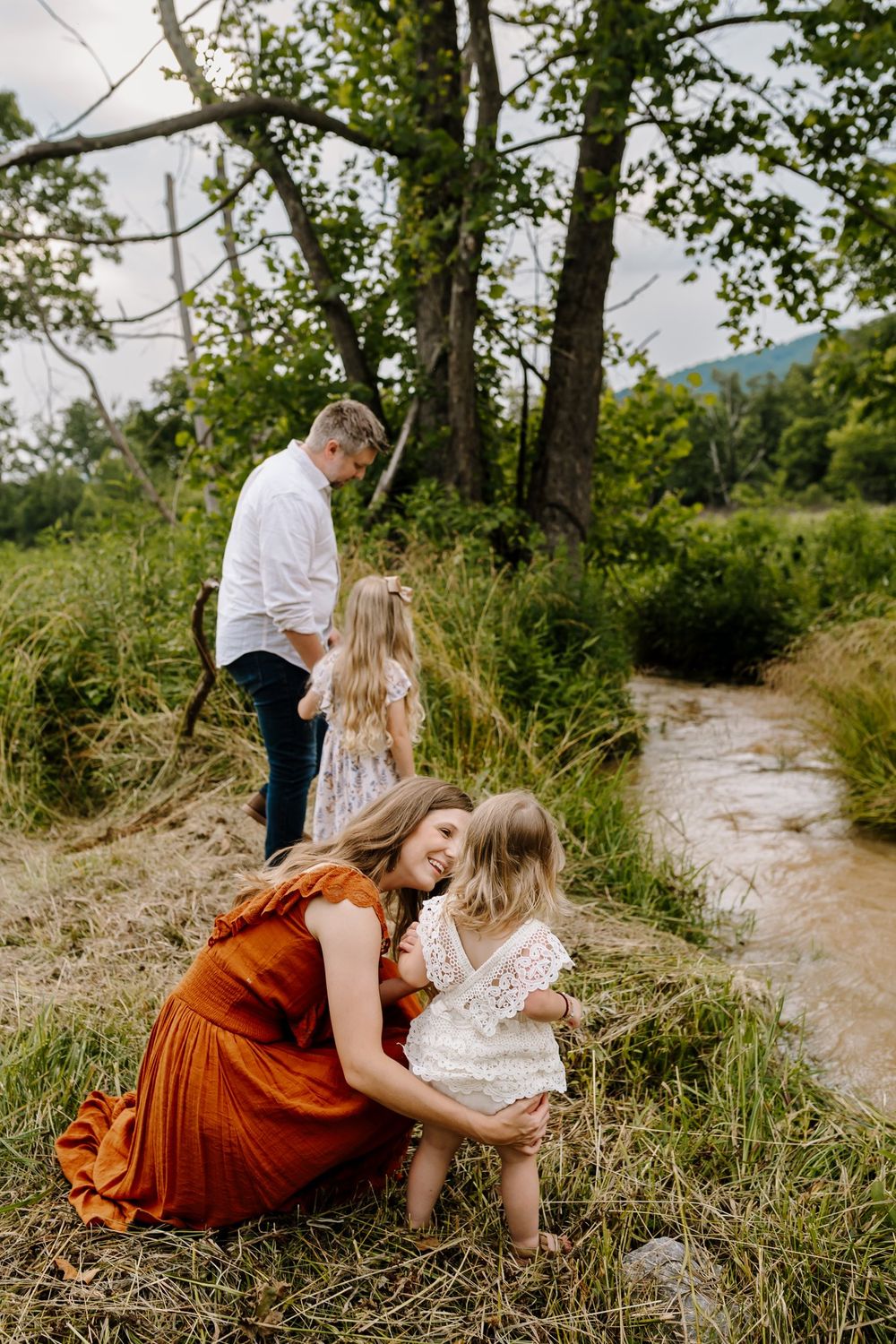 Family plays by the creek together