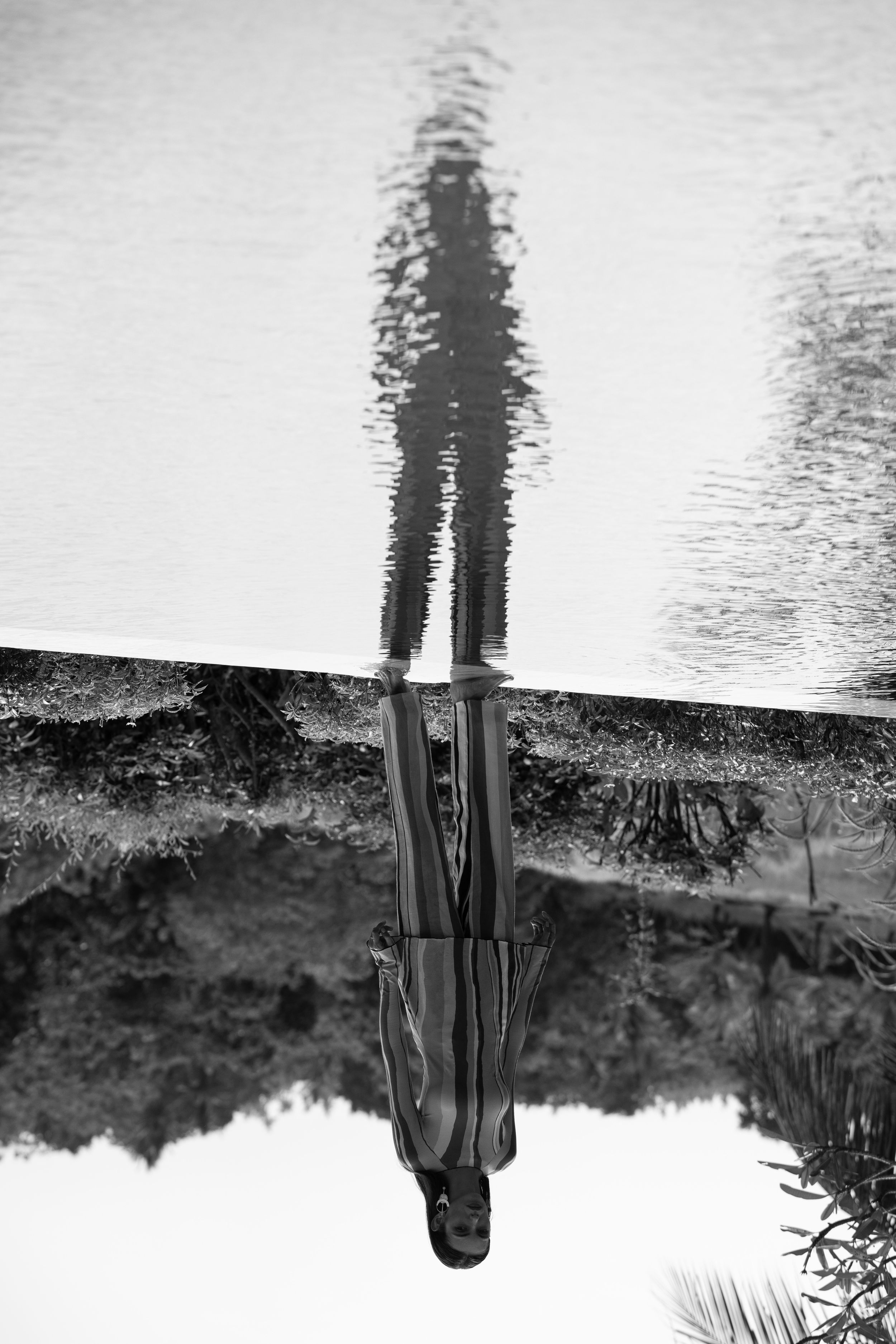 Artistic black and white reflection in water creating a mirror image effect.