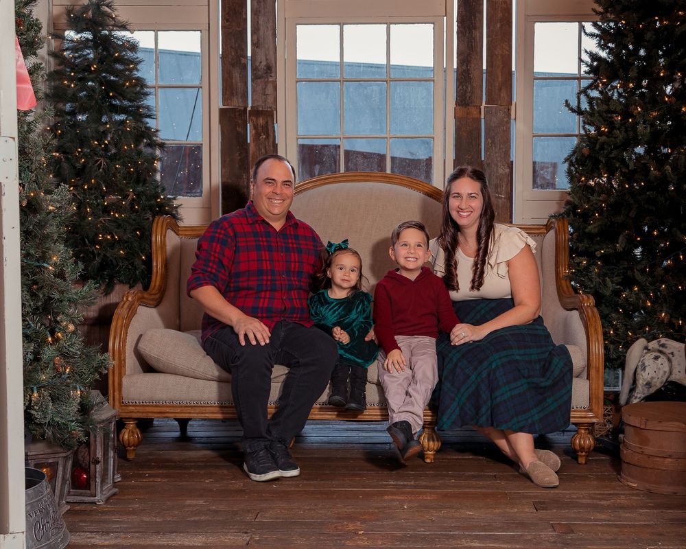 A series of connected family photos showing people sitting and posing on a wooden porch with evergreen trees in the background.