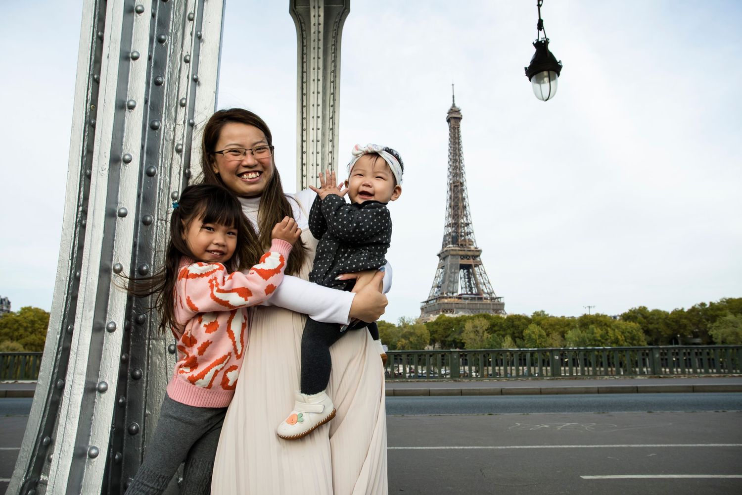 Anniversary photoshoot in Paris: Timeless memories by Picmytrip Paris.. Kids laughing at the Eiffel tower PAris