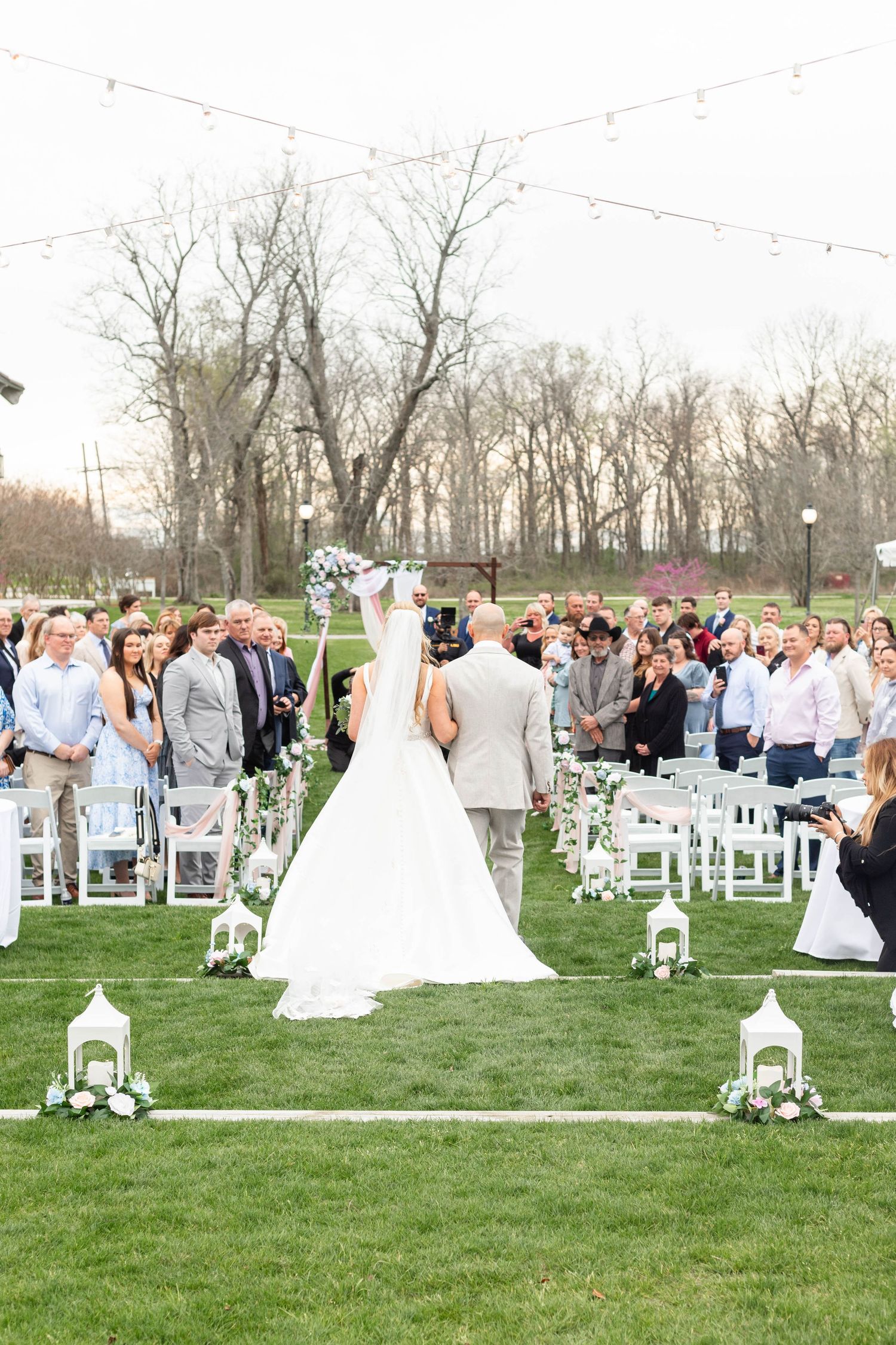 bride walking with dad at pointe marie subdivision in baton rouge, la
