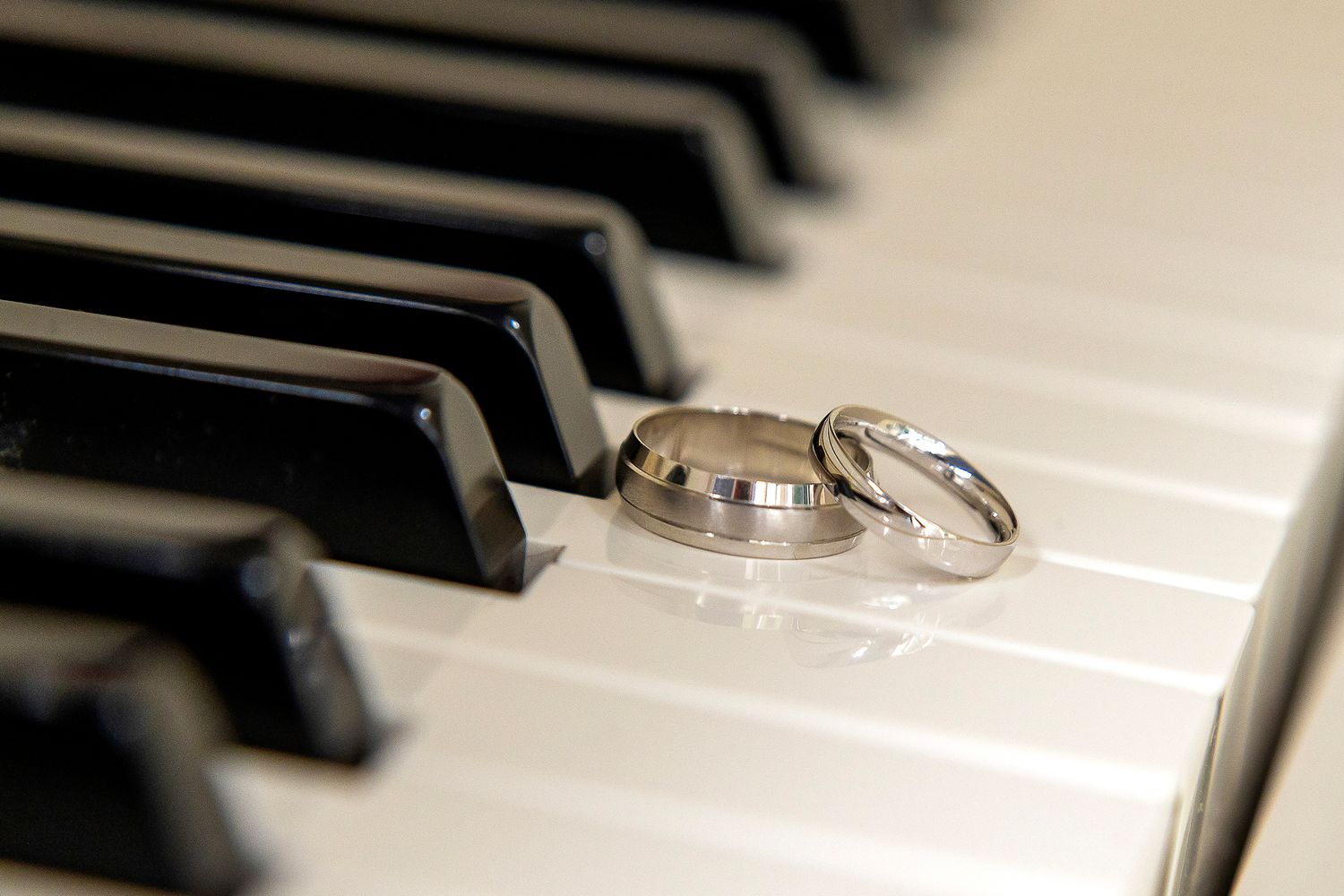 wedding rings on the keys of a piano wedding photography shuttle hall Derbyshire