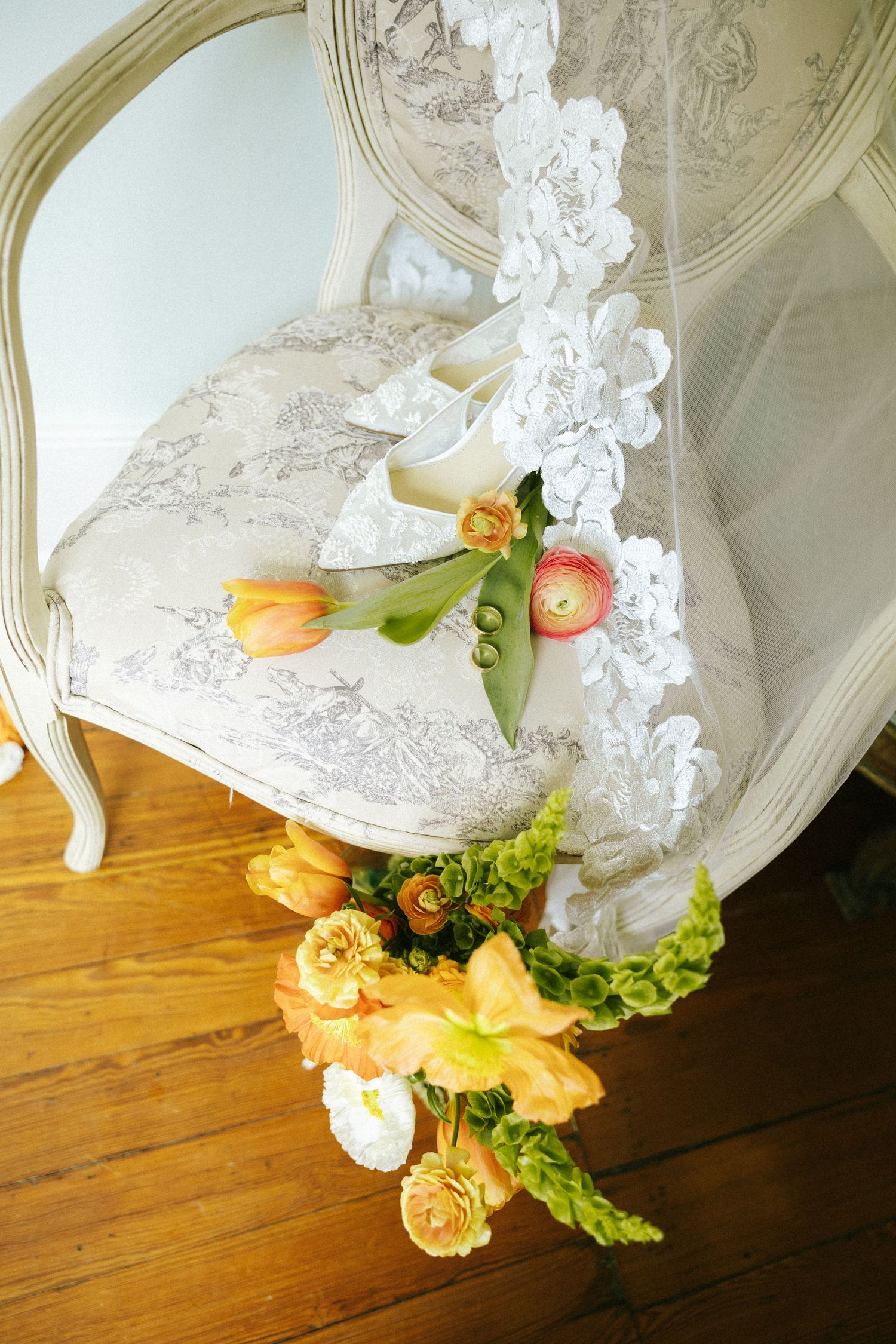 A full dinner table at the wedding reception, angled diagonally at the Bellwether Inn