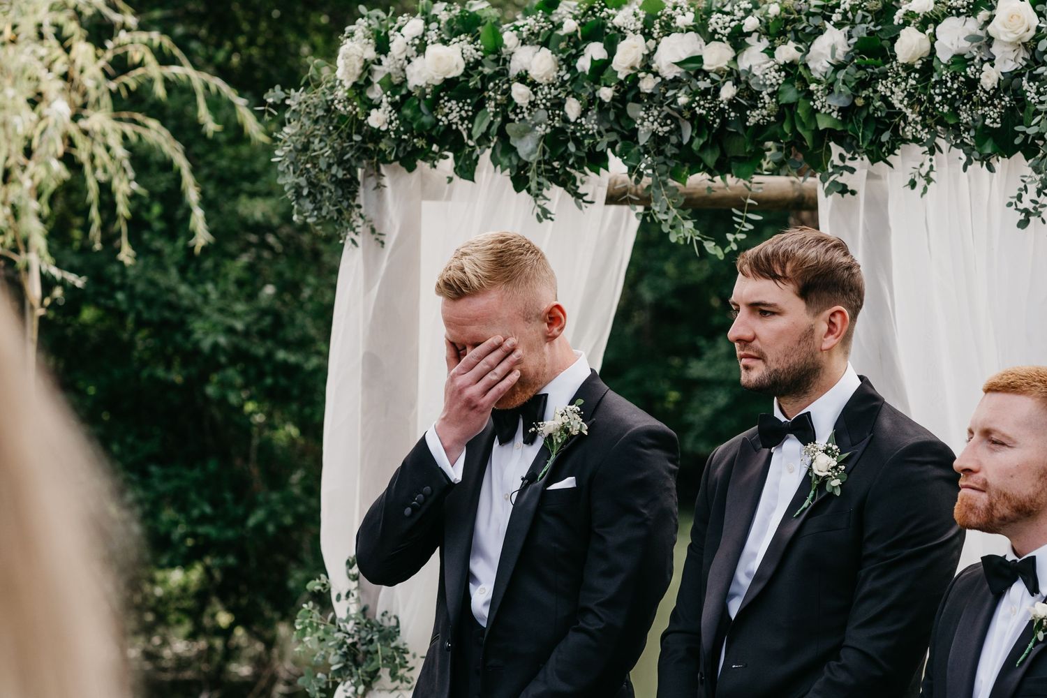 groom reaction during outdoor ceremony