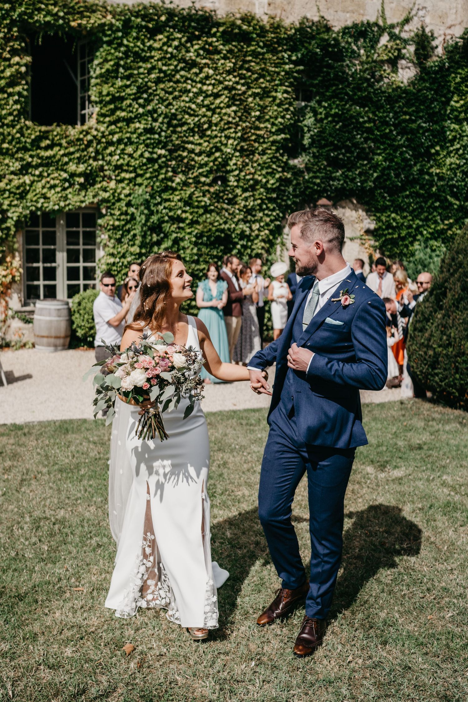 bride and groom walking at Chateau Rigaud
