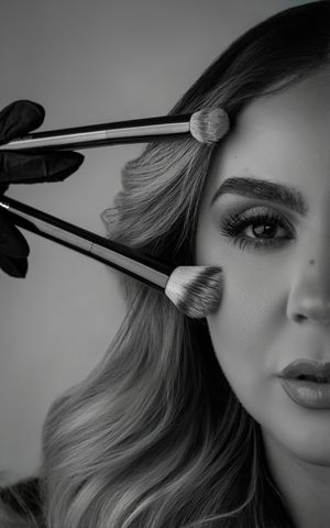 Black and white photo series showing makeup brushes applying cosmetics in a professional beauty tutorial sequence.